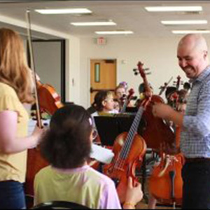 Estefan, Owner teaching Music Lessons