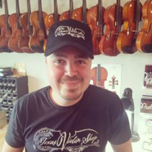 Estefan, Owner selfie in music repair shop